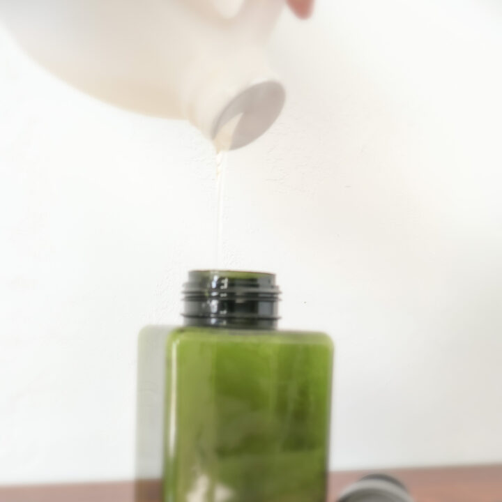 Pouring Castile Soap in Shampoo Bottle