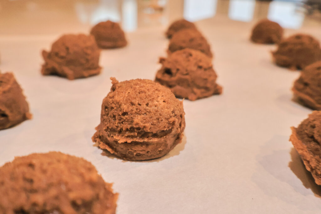  simple 3 ingredient peanut butter cookies balled and put on a cookie sheet