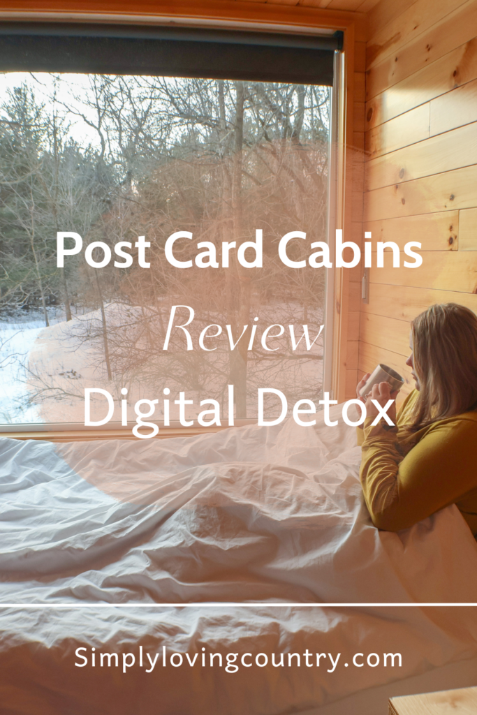 post cards cabin review digital detox women looking out window drinking coffee